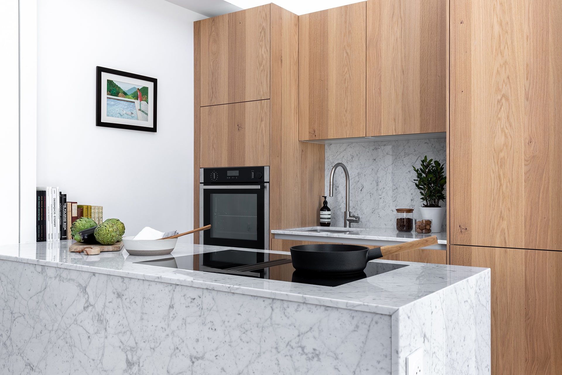 Small grey kitchen with a white central island