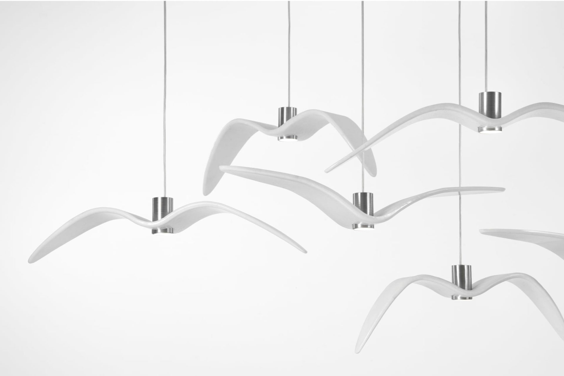 Pendant lamps made of white glass, inspired by the flying birds