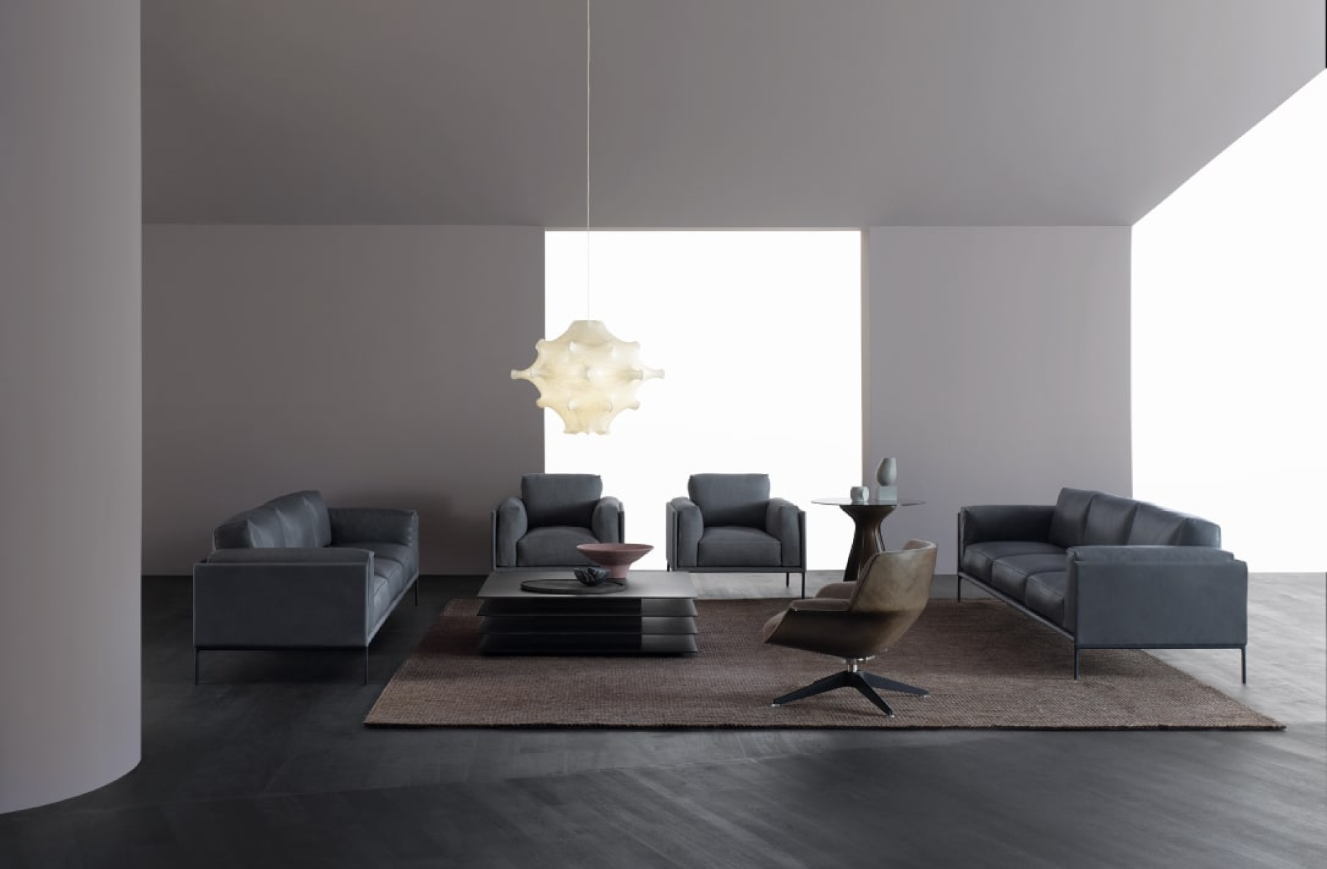 Living room furniture including two dark grey sofas