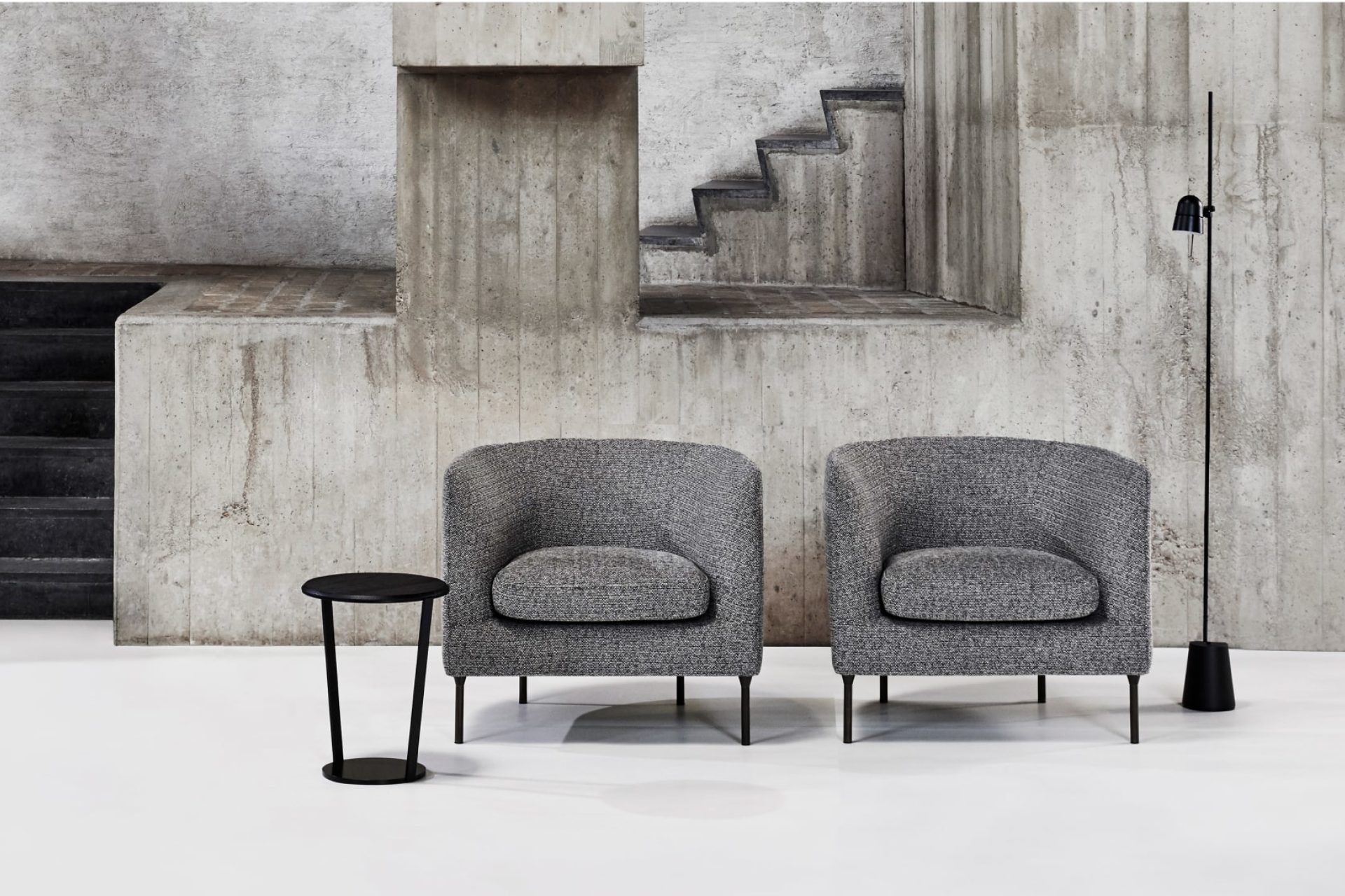 Two mottled-grey canvas armchairs with a removable cover