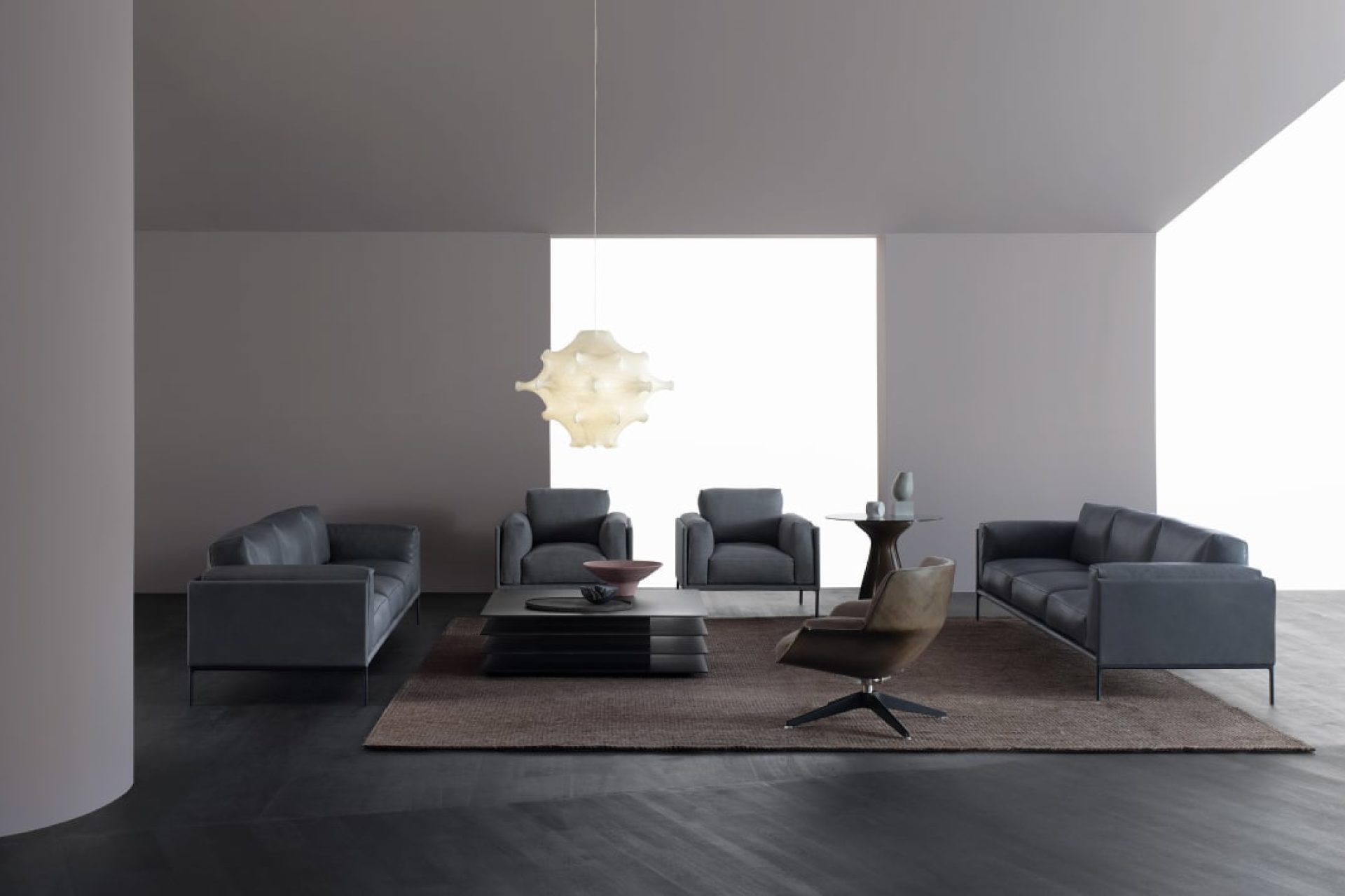 Living room furniture including two dark grey sofas
