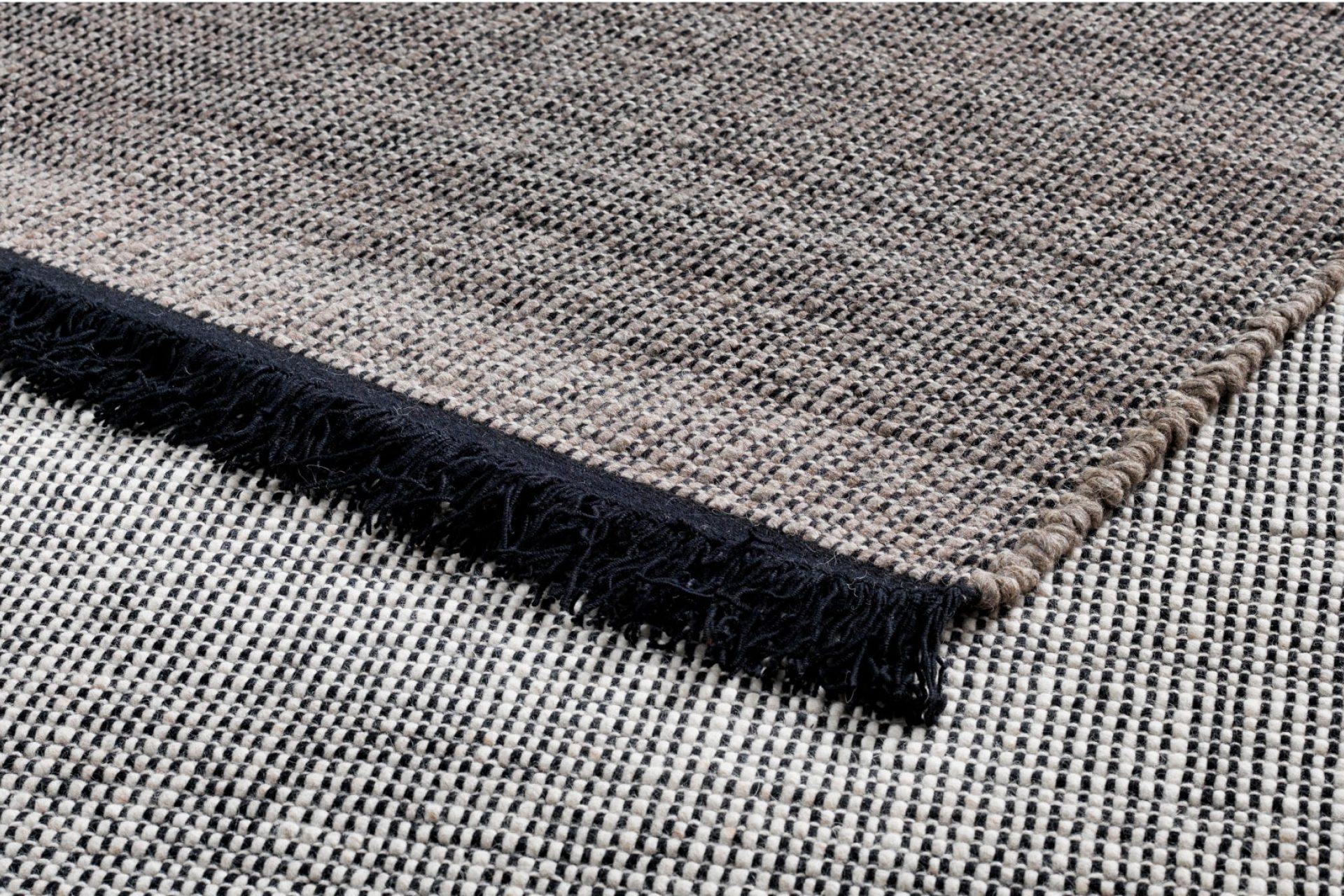 Display showing two parts of high-end, high-quality rugs