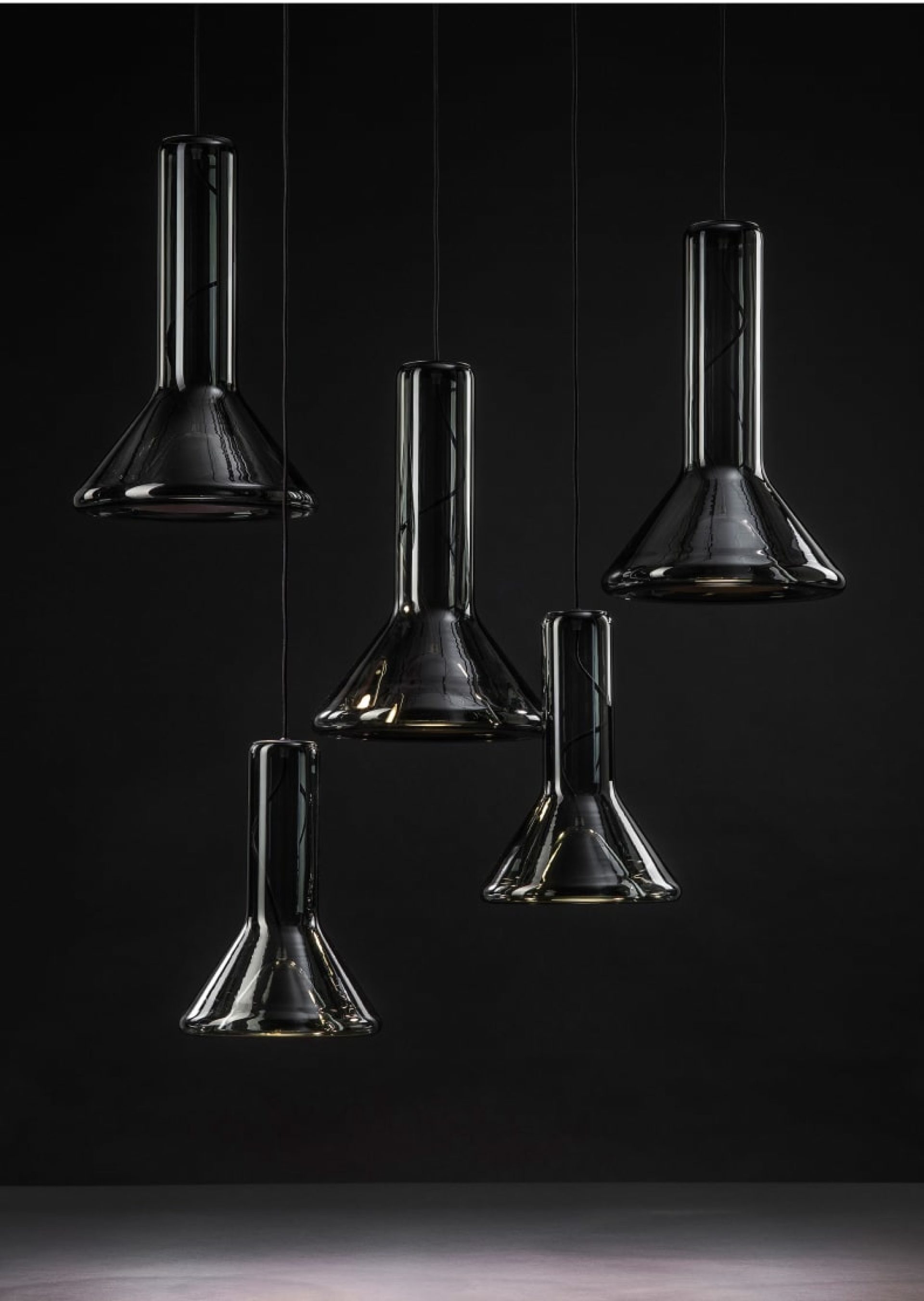 Five black-glass pendant lamps