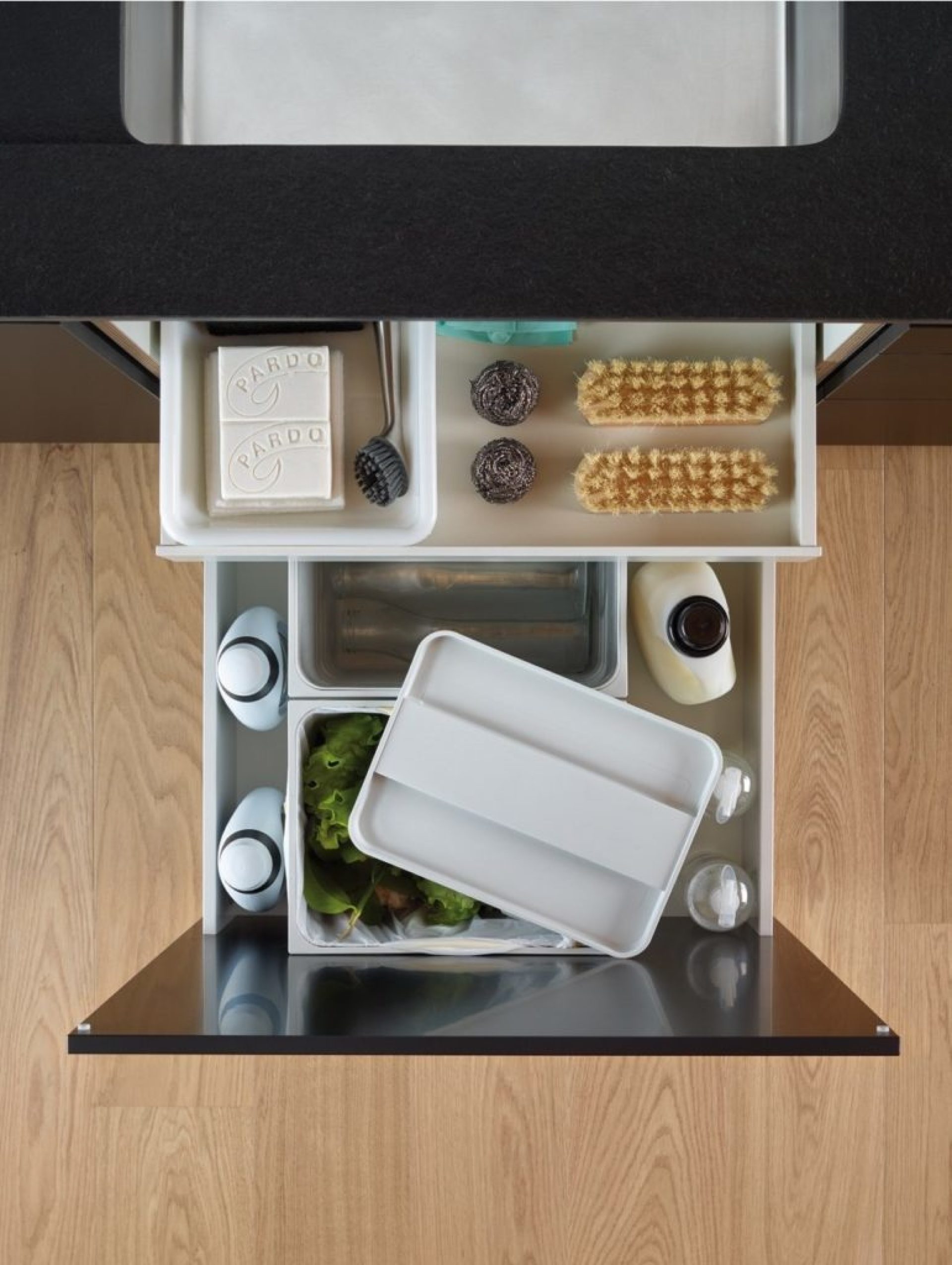 Image of storage accessories for under-sink drawers for storing cleaning products or waste 