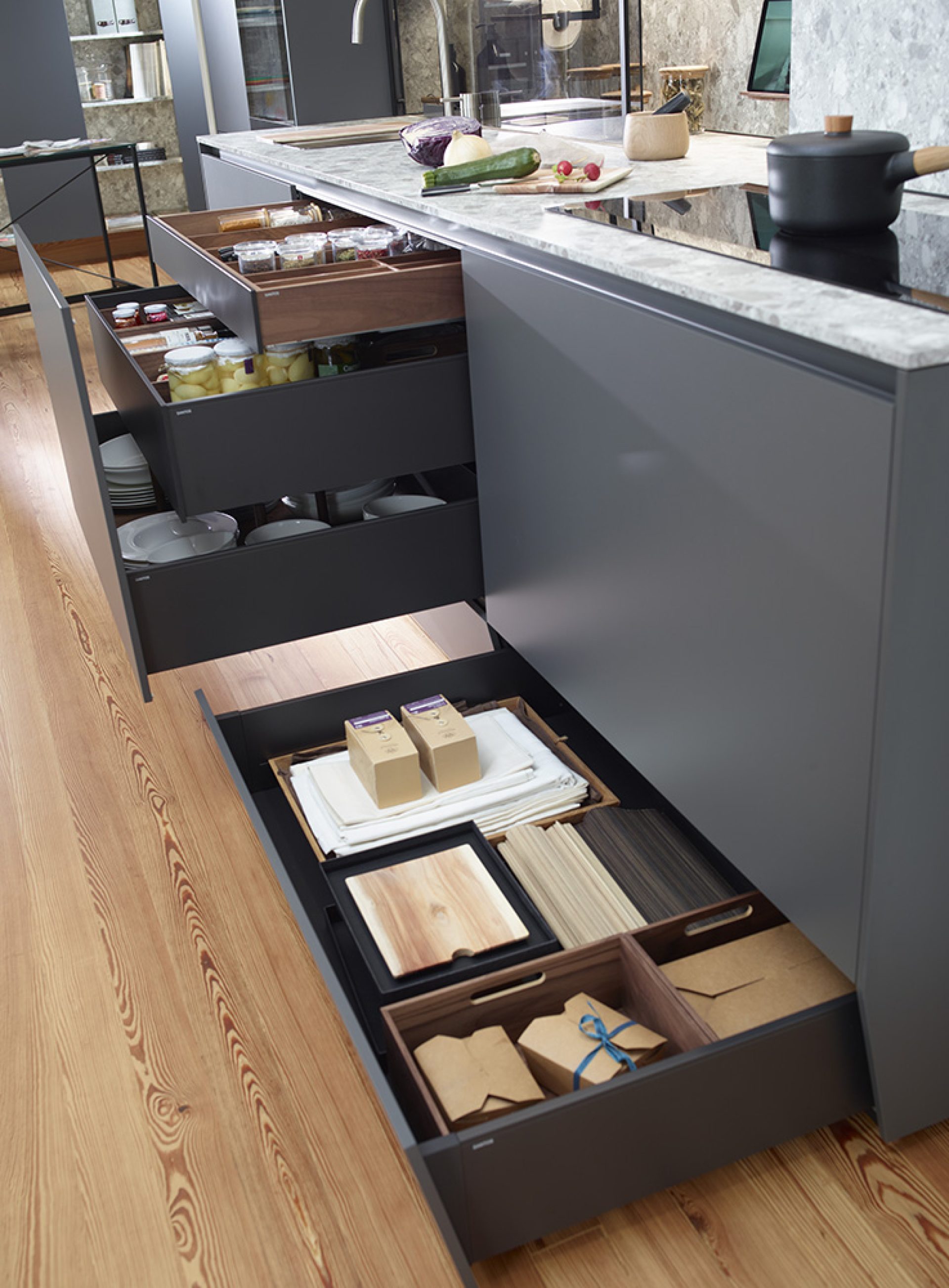 Image of kitchen base units with plinth drawers and organization boxes